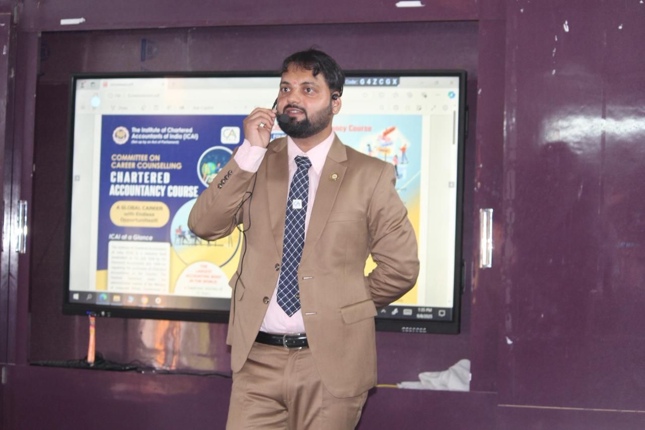A man smiling during a meeting